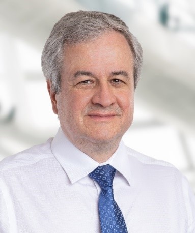 Headshot of a man wearing a tie